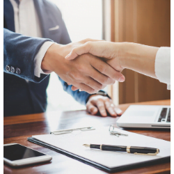 An image of two people shaking hands